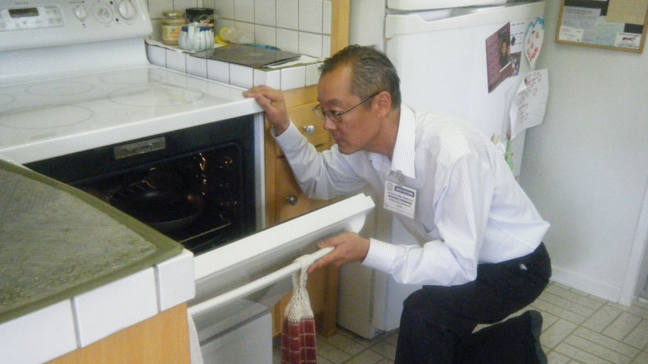 home inspector inspects oven